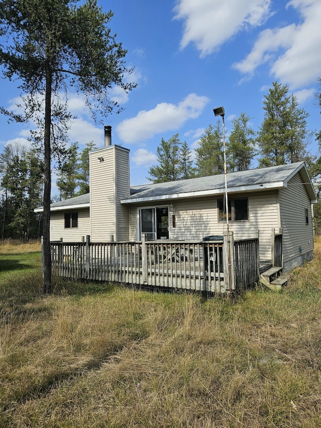 back of property with a deck