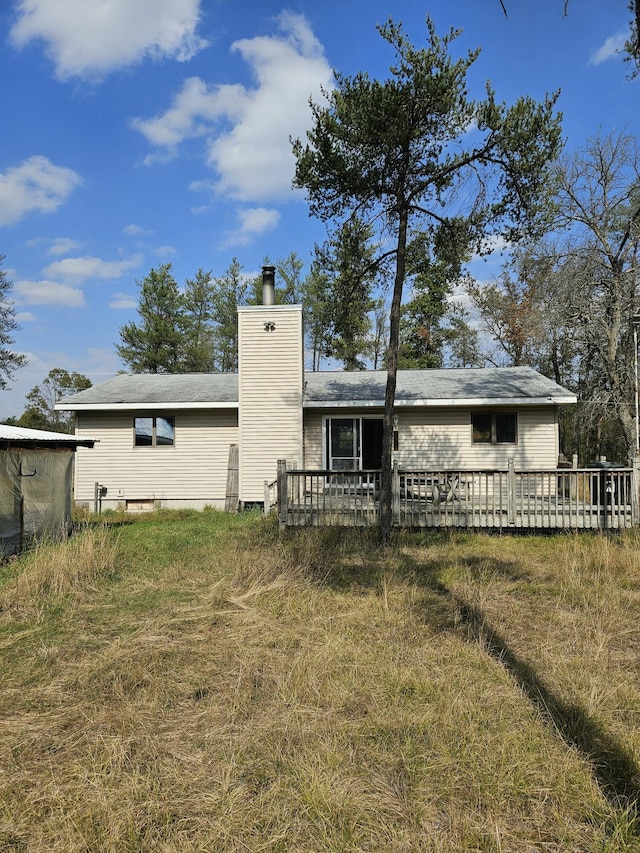 back of property featuring a wooden deck