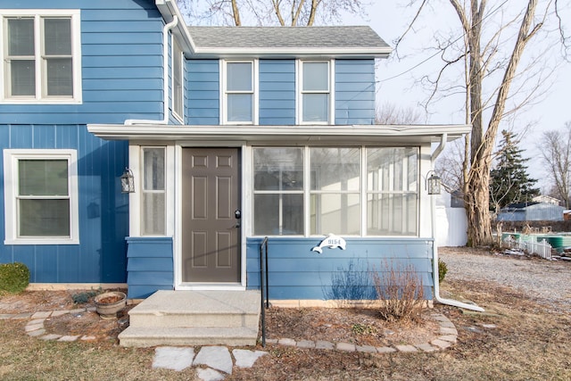 view of front of house featuring a sunroom