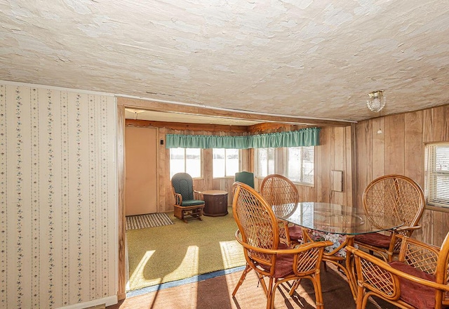 dining area with a textured ceiling