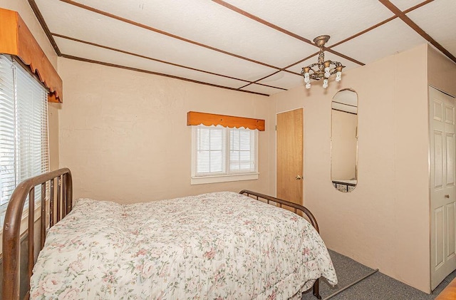 bedroom featuring an inviting chandelier