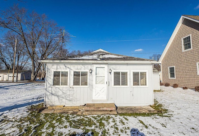 view of snow covered house