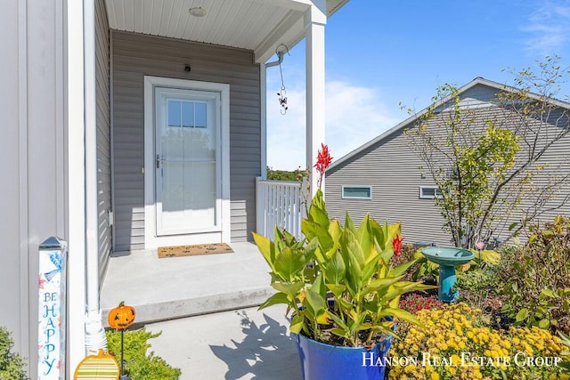 doorway to property featuring a porch