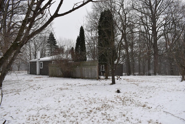 view of yard covered in snow