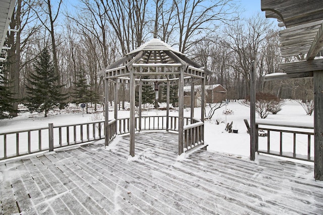 snow covered deck featuring a gazebo