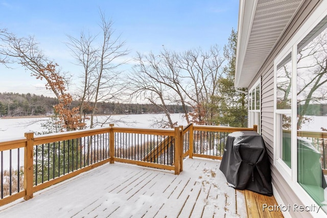 snow covered deck with area for grilling