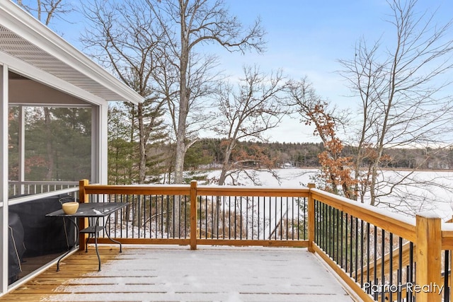 view of snow covered deck