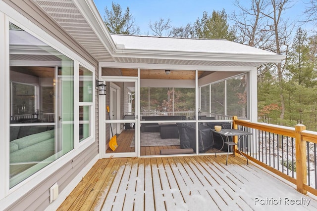 deck with a sunroom