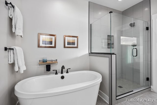 bathroom with shower with separate bathtub