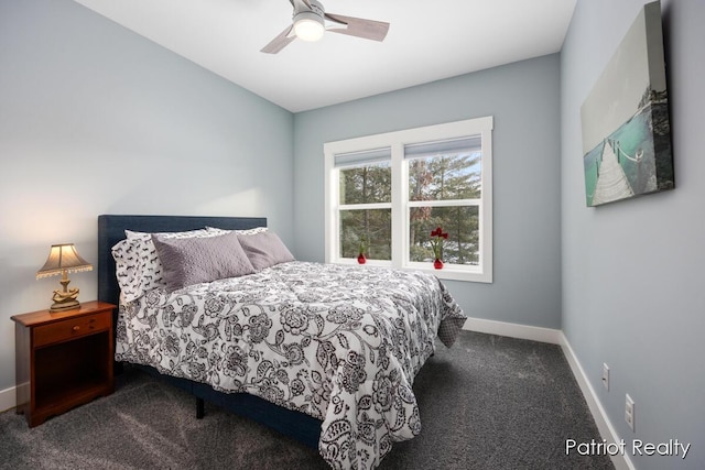 bedroom with ceiling fan and dark carpet