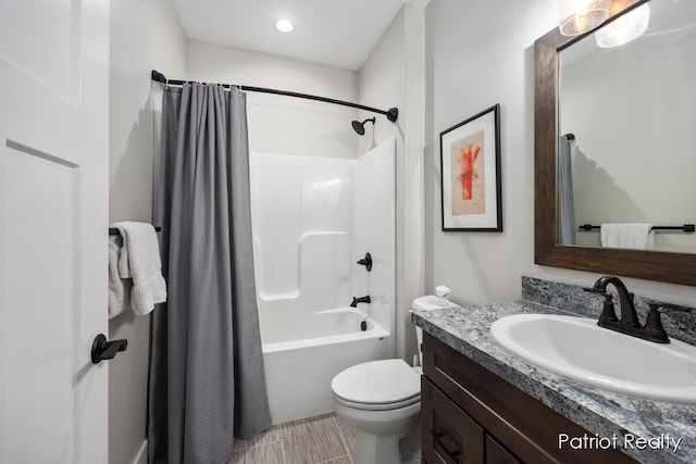 full bathroom with toilet, vanity, and shower / tub combo with curtain