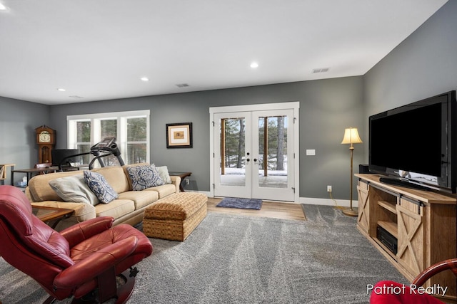 carpeted living room featuring french doors