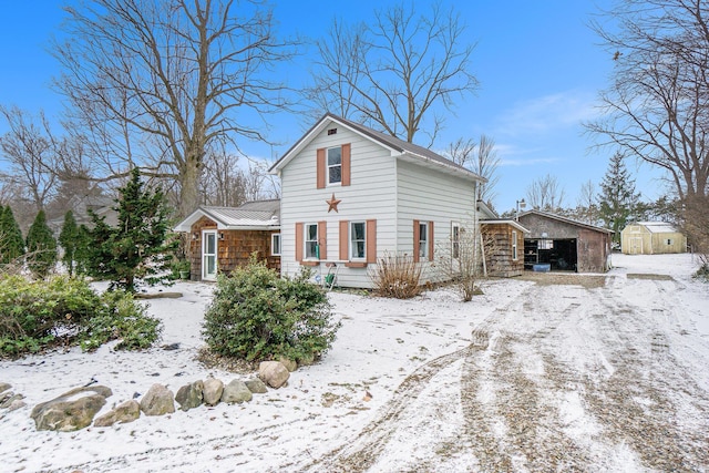 view of front of home with a storage shed