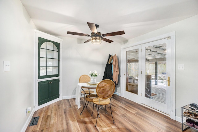 dining area featuring light hardwood / wood-style flooring and ceiling fan