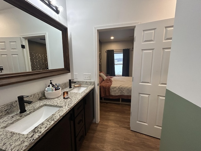 bathroom with hardwood / wood-style flooring and vanity