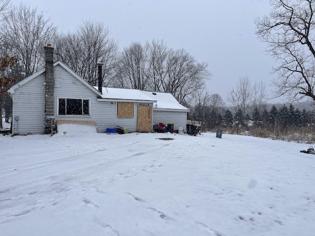 view of snow covered house