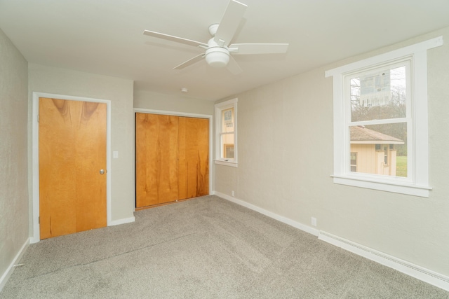 unfurnished bedroom with a closet, ceiling fan, and light colored carpet