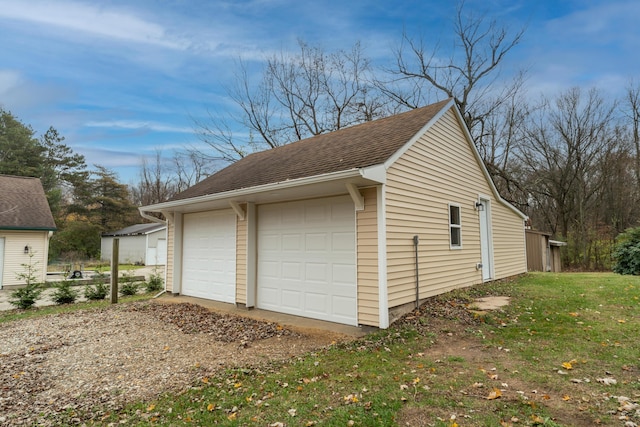 garage featuring a yard