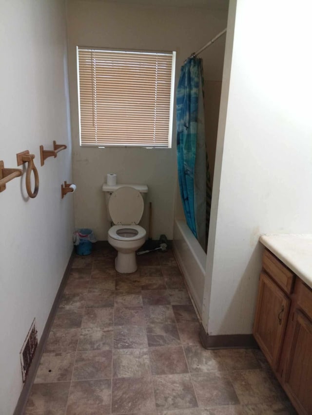 full bathroom with toilet, vanity, and shower / bathtub combination with curtain