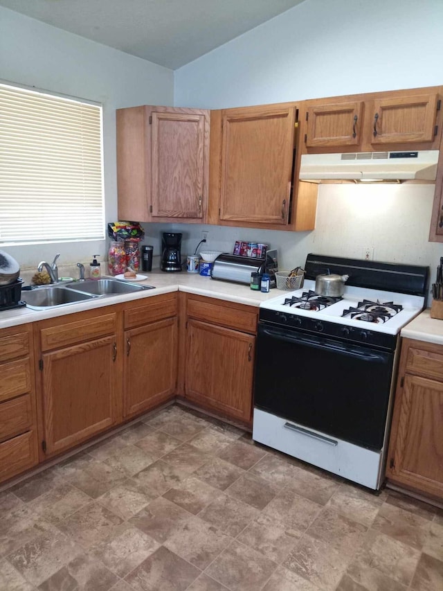 kitchen featuring sink and white gas range oven