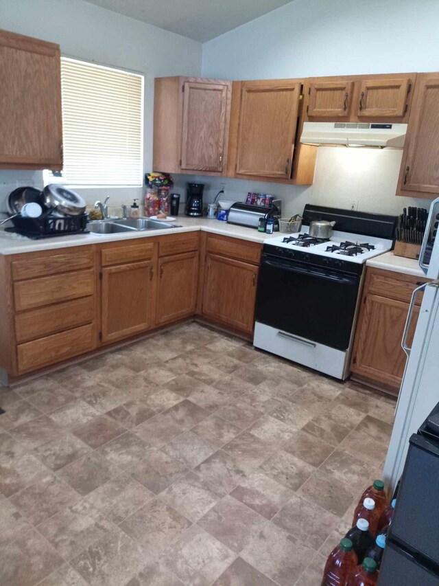 kitchen with sink and white gas range