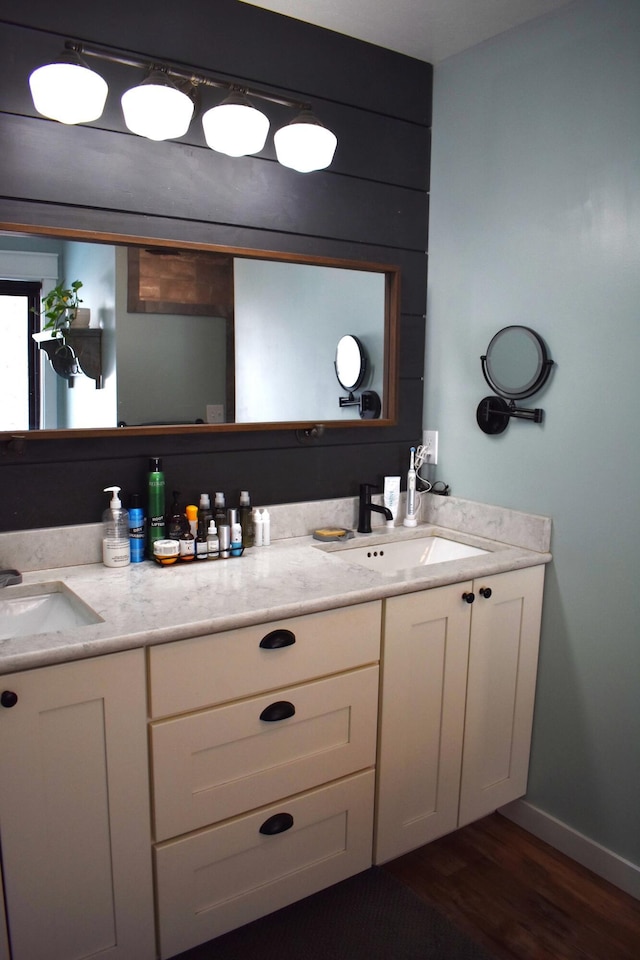 bathroom featuring vanity and hardwood / wood-style floors