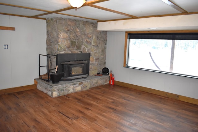 living room with a wood stove and dark hardwood / wood-style floors