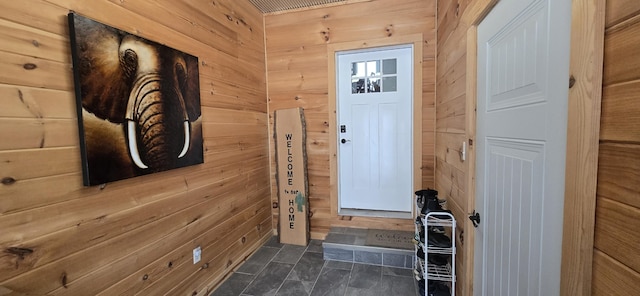 doorway with wooden walls