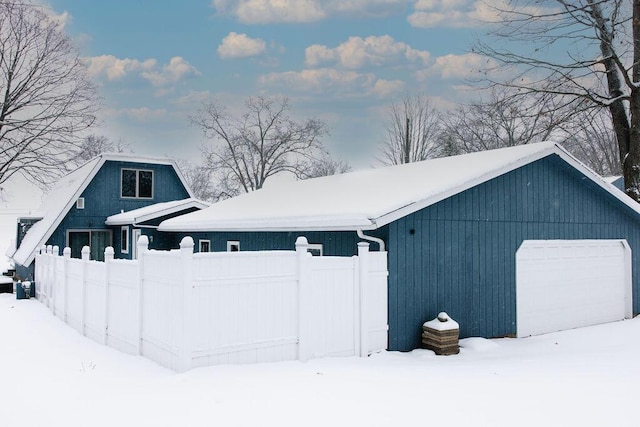 view of snow covered garage