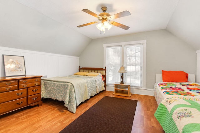 bedroom featuring wood-type flooring, ceiling fan, and lofted ceiling