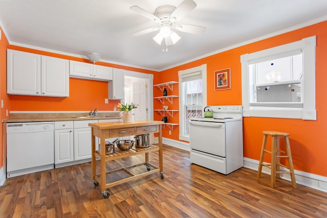 kitchen featuring ceiling fan, sink, dark hardwood / wood-style floors, white appliances, and white cabinets