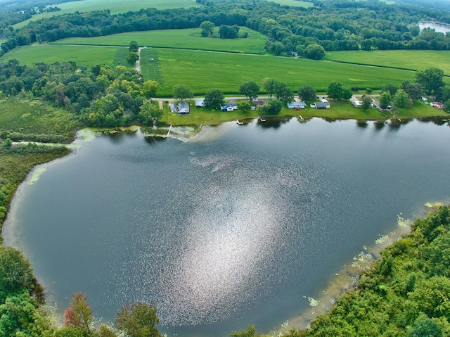 birds eye view of property with a water view and a rural view