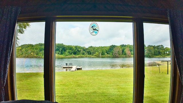 doorway to outside with a water view