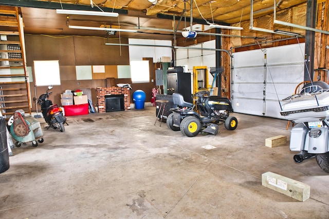 garage with electric panel and a garage door opener