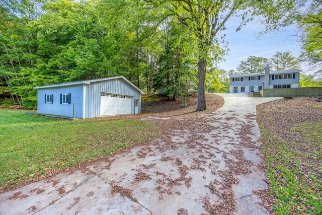 view of yard featuring an outbuilding and a garage