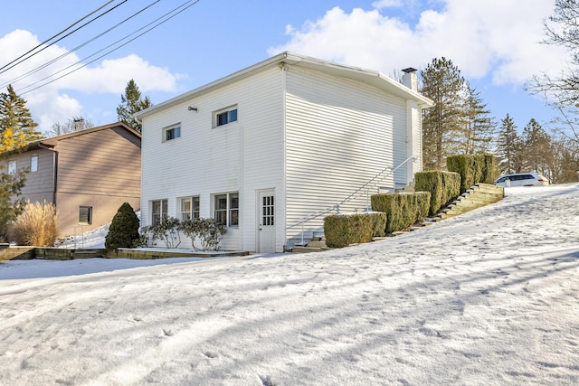 view of snow covered property