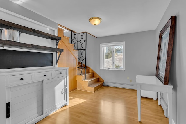 interior space with baseboard heating and wood-type flooring