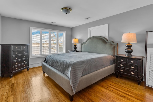 bedroom with hardwood / wood-style flooring