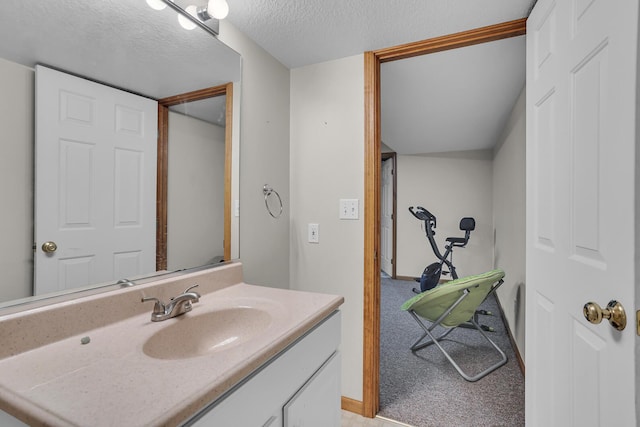 bathroom featuring vanity and a textured ceiling