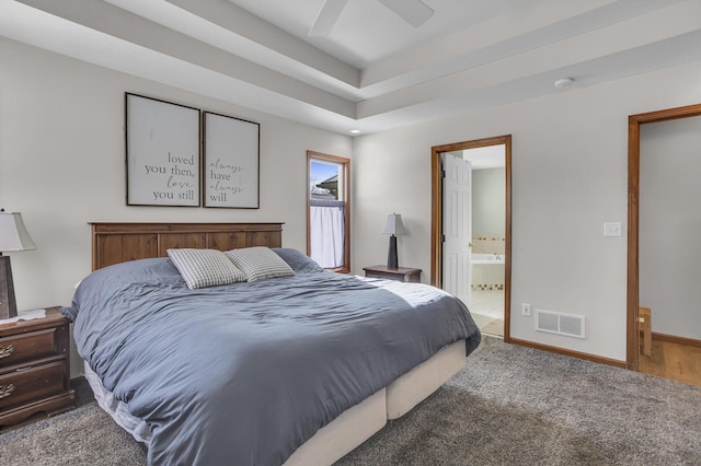 bedroom with ensuite bath, ceiling fan, and carpet flooring