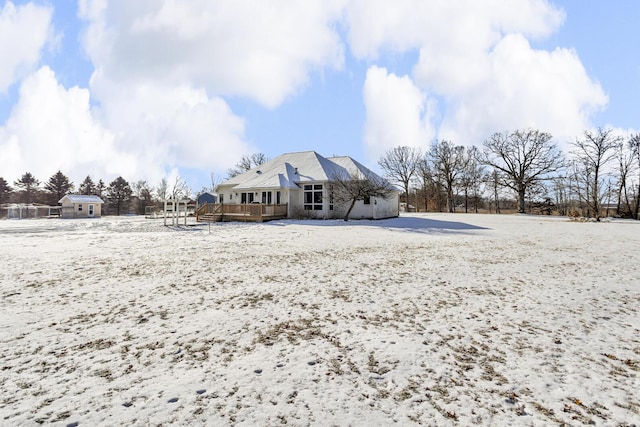 view of snow covered house