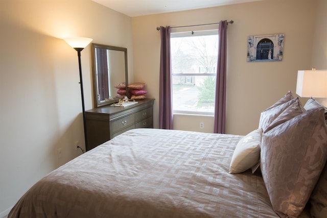 bedroom featuring multiple windows