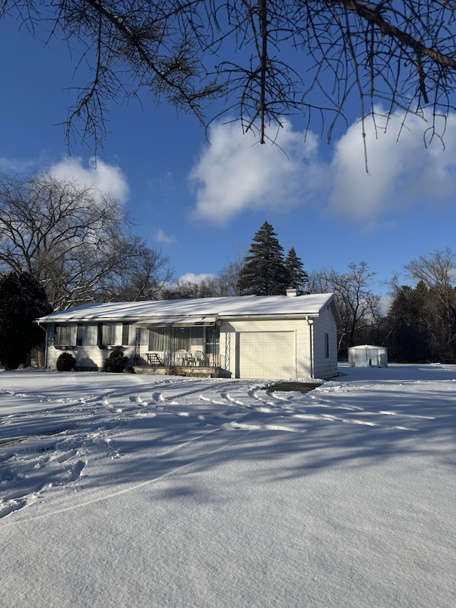 view of front of house with a garage and covered porch