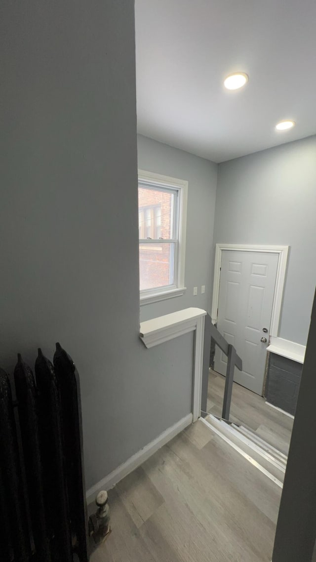 bathroom with hardwood / wood-style flooring