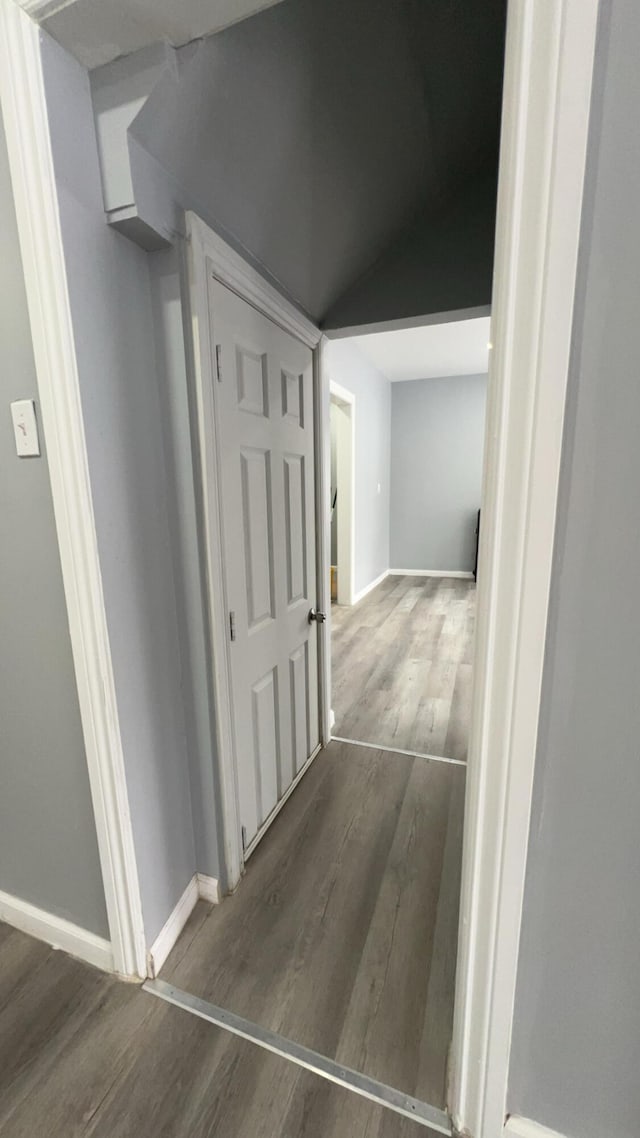 hall with dark hardwood / wood-style floors