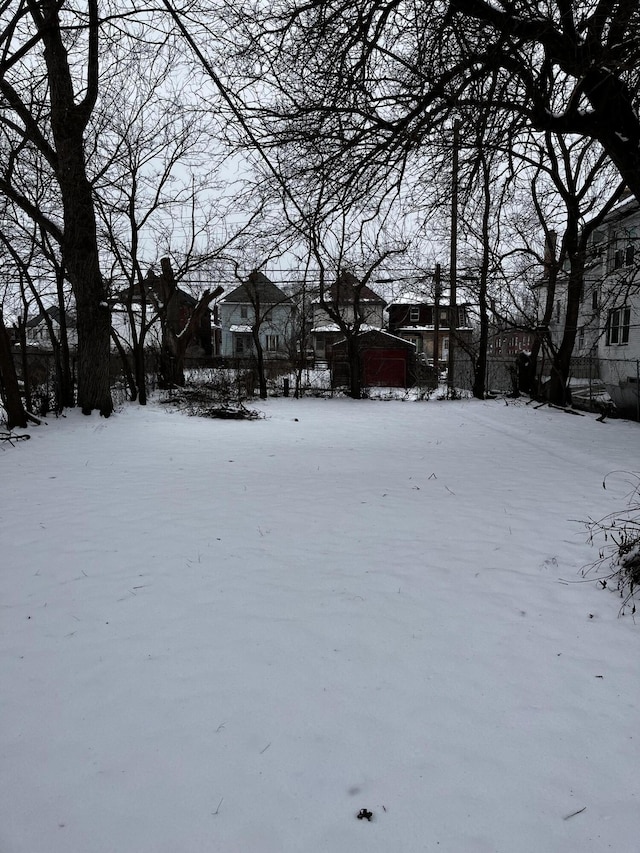 view of yard layered in snow