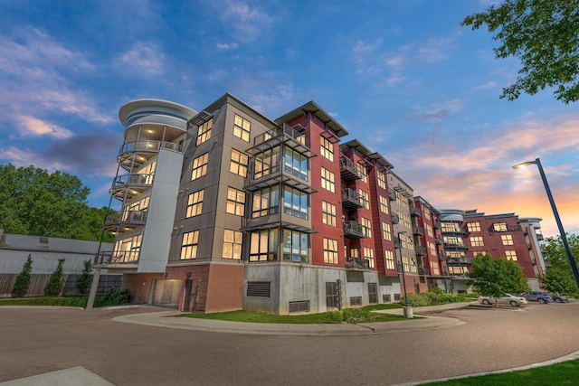 view of outdoor building at dusk