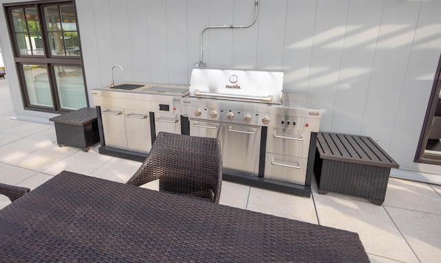 view of patio / terrace featuring exterior kitchen and sink