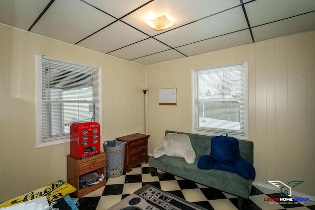 bedroom featuring wooden walls