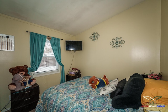 bedroom featuring lofted ceiling